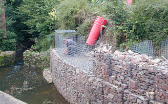David's Curved gabion wall protecting against river erosion.
